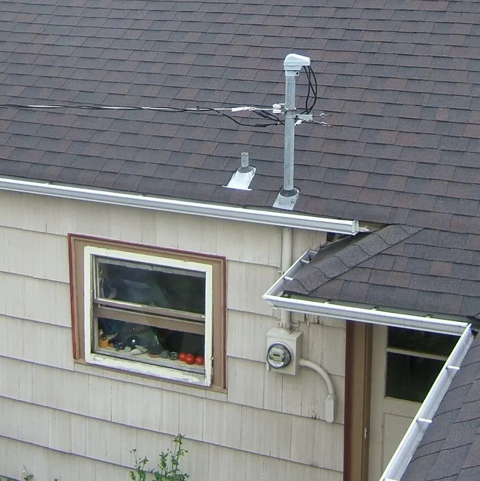 An overhead electrical service drop at a residence