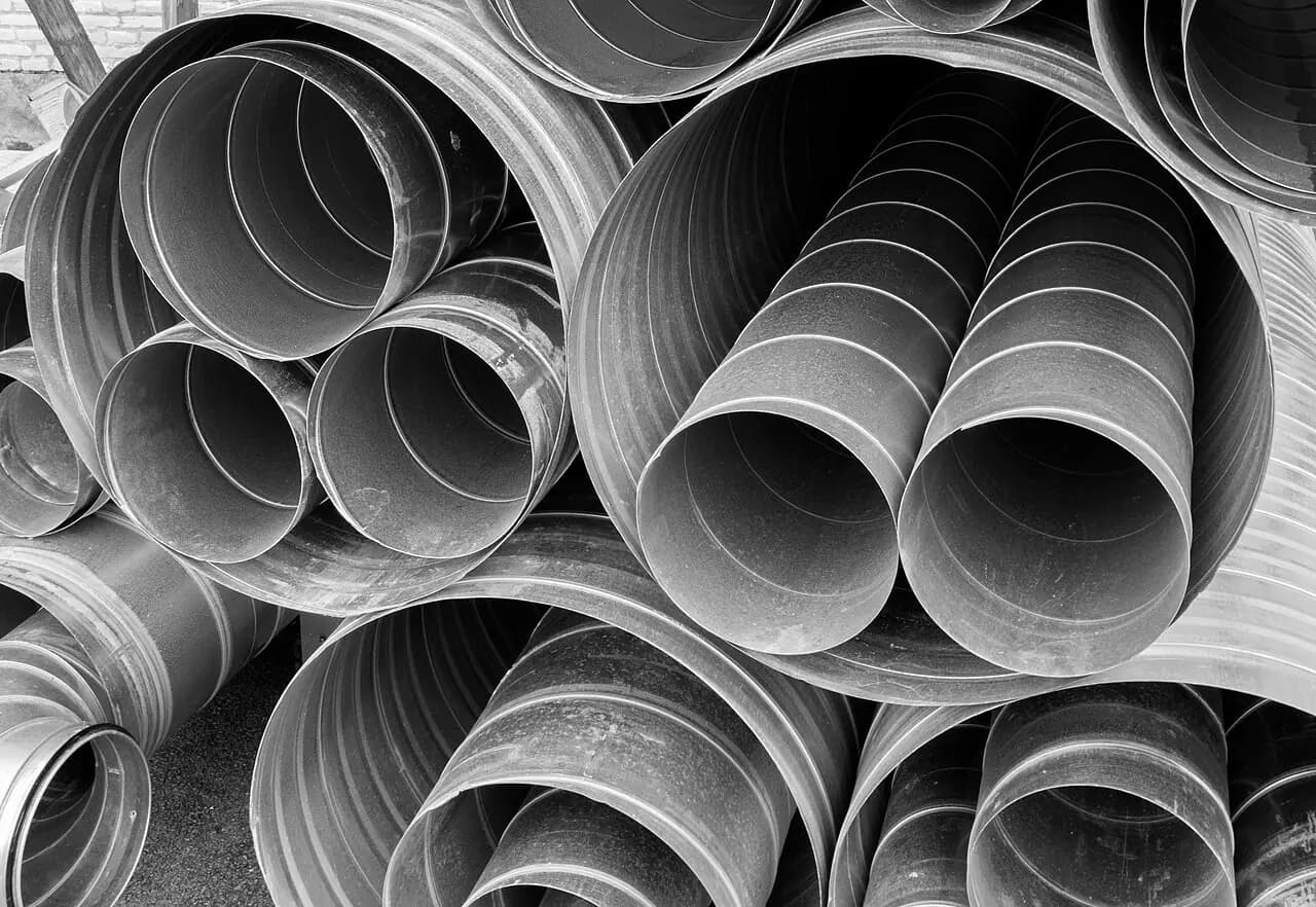 Lengths of metal ventilation ducting ready for installation