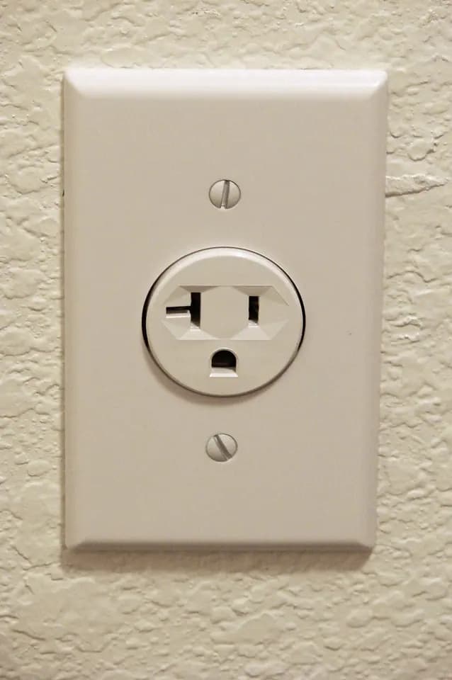A NEMA electrical wall receptacle